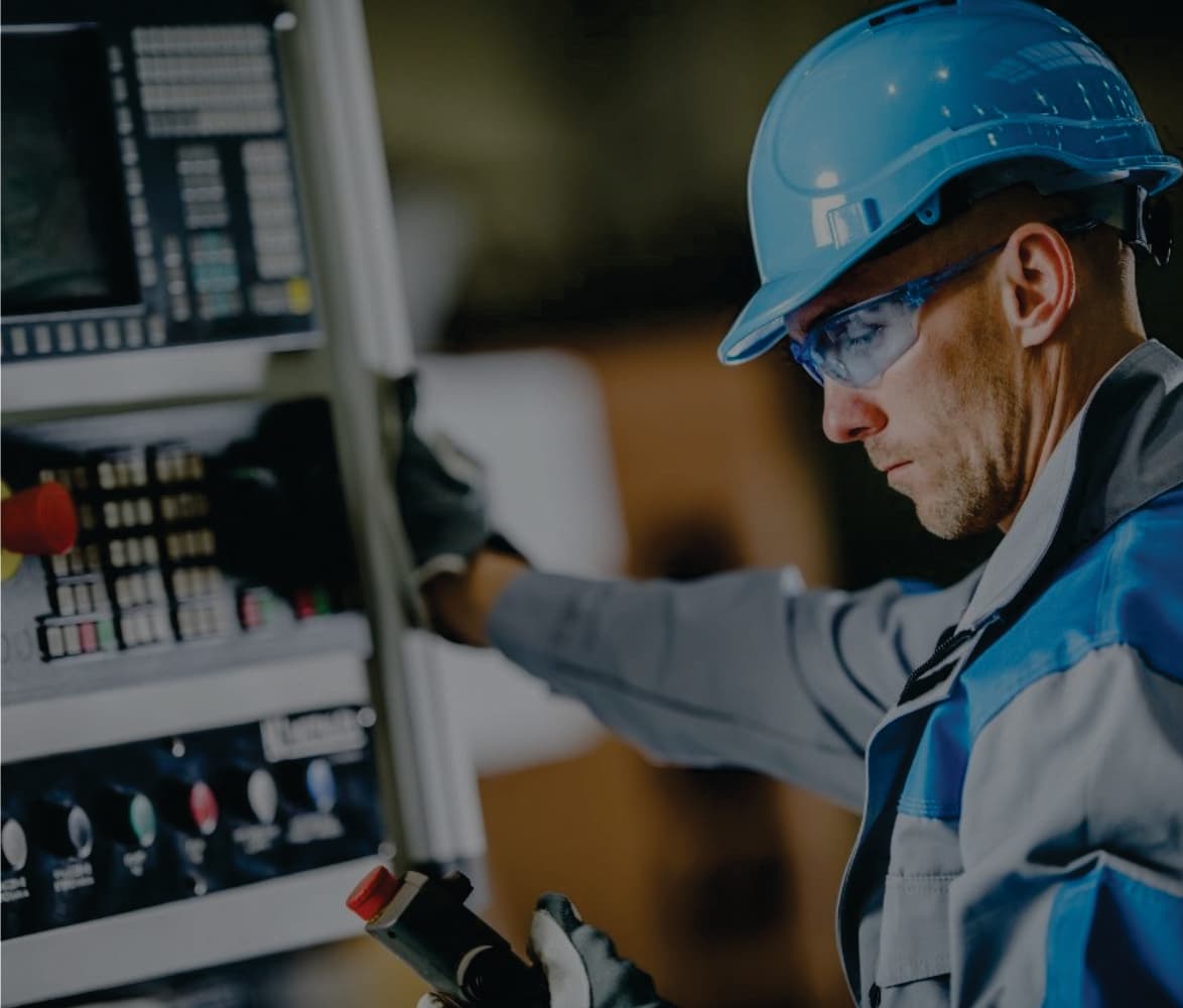 Engineer operating CNC machinery